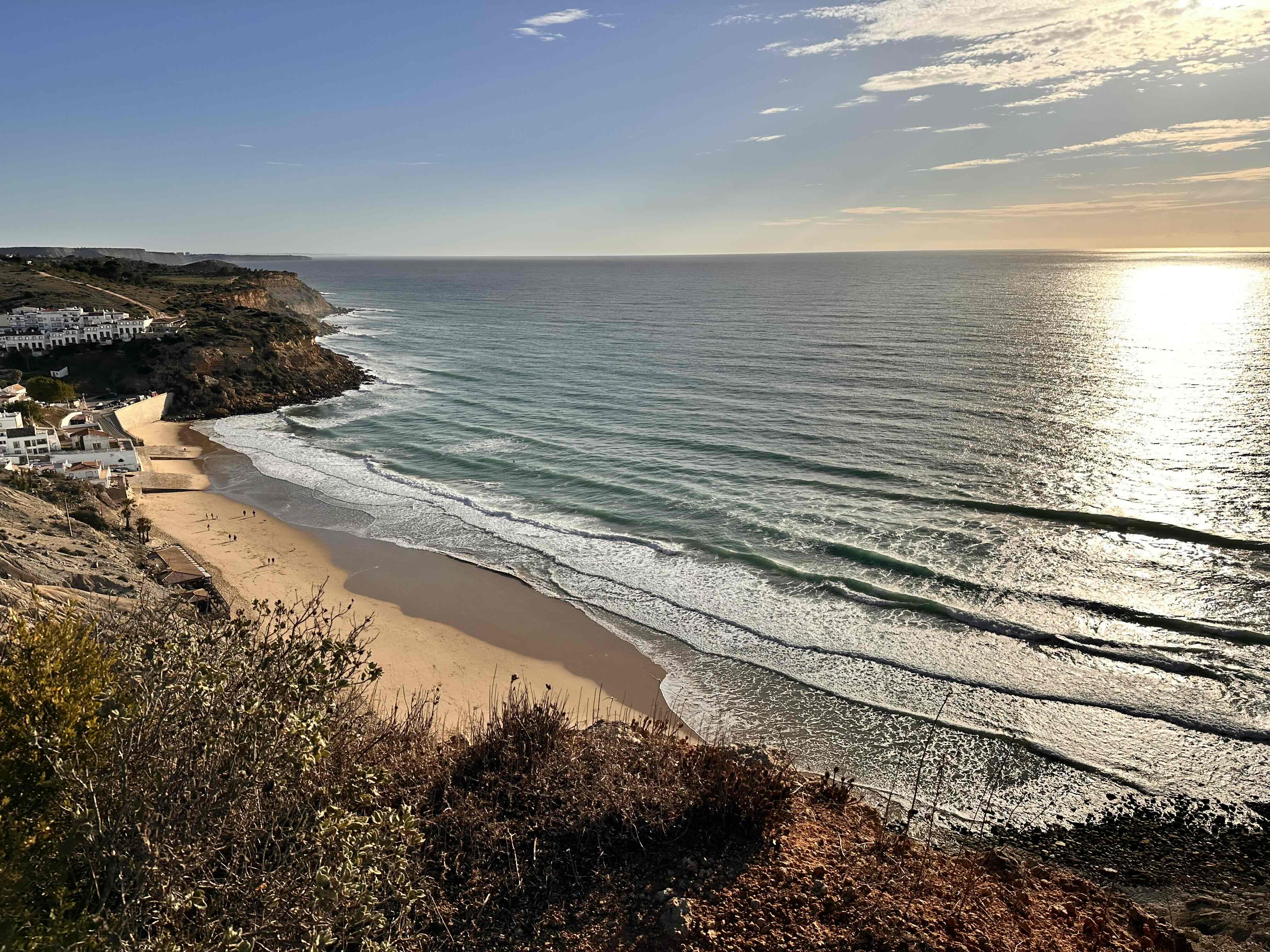 Sweeping view of the Western Algarve coastline and beach at golden hour