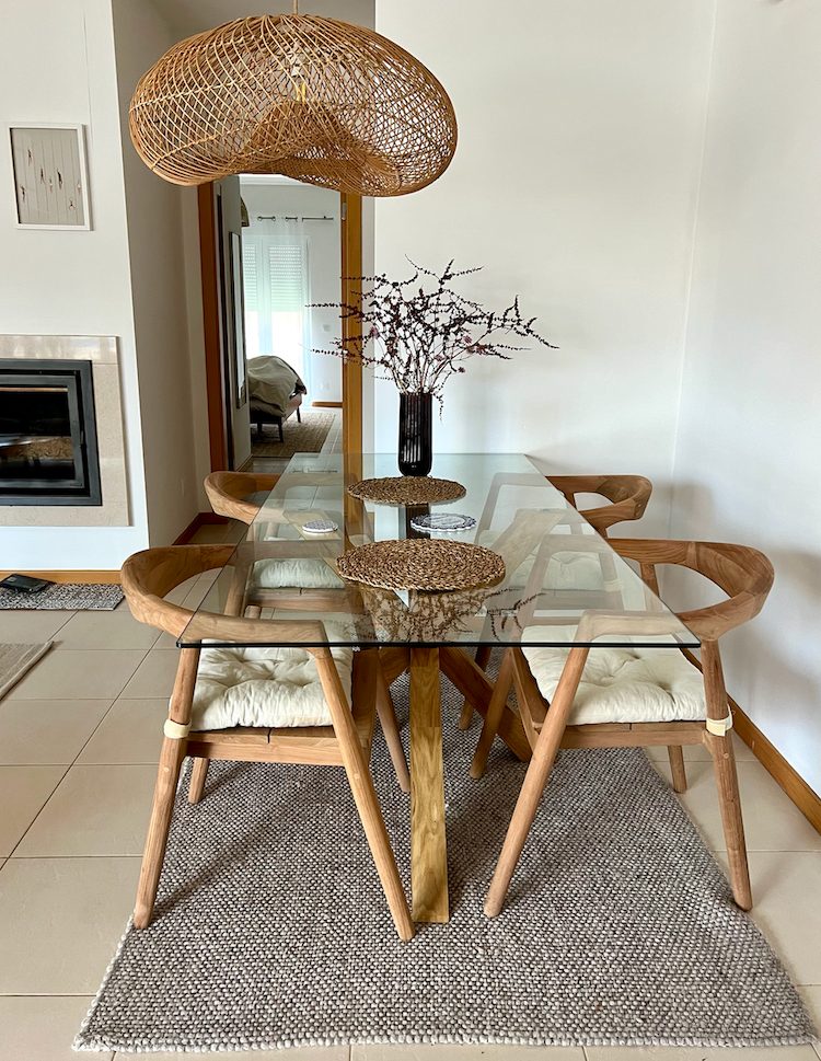 Glass dining table with woven pendant light