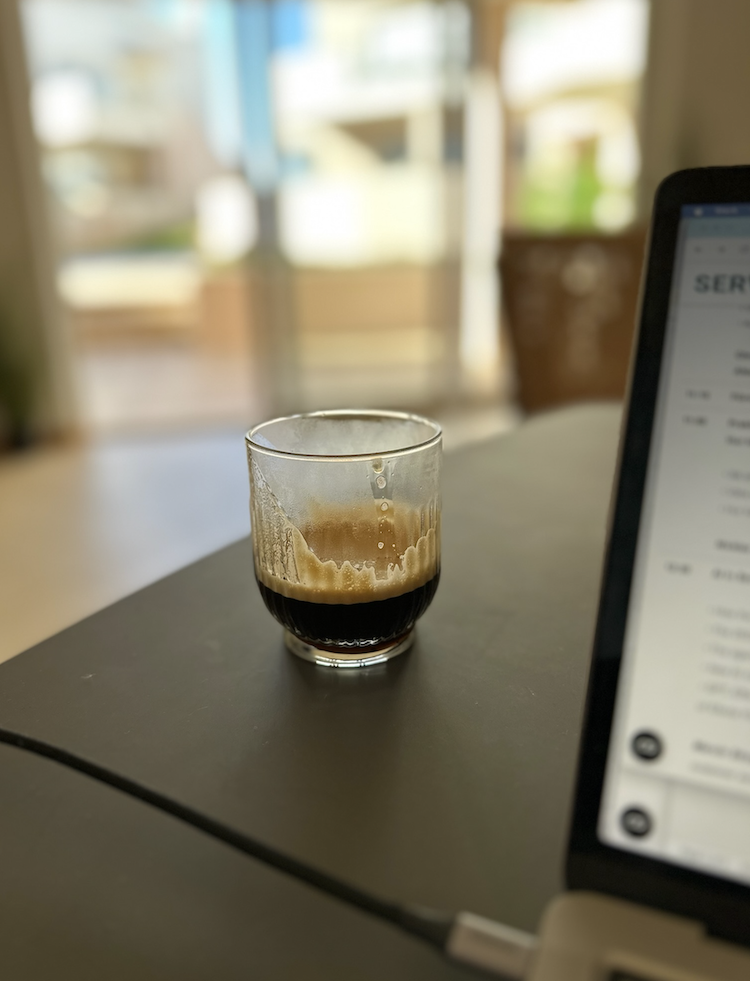 Coffee on the desk beside a laptop at Casa Solaris